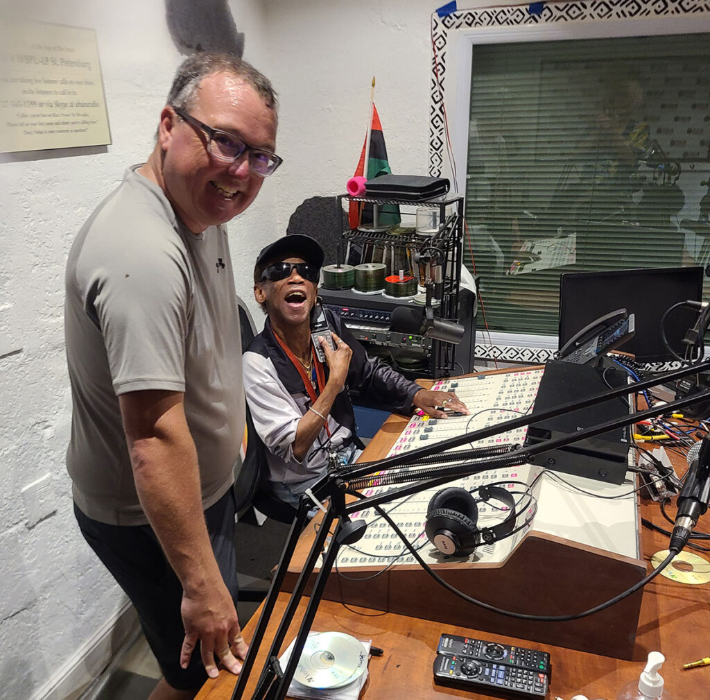 Engineering support volunteer Chris W. of Radio Free Gulfport(left) donated one of the replacement boards, with DJ Eddie (right).